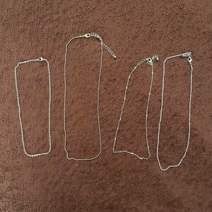 Set of Four Silver Chain Necklaces of Varying Lengths